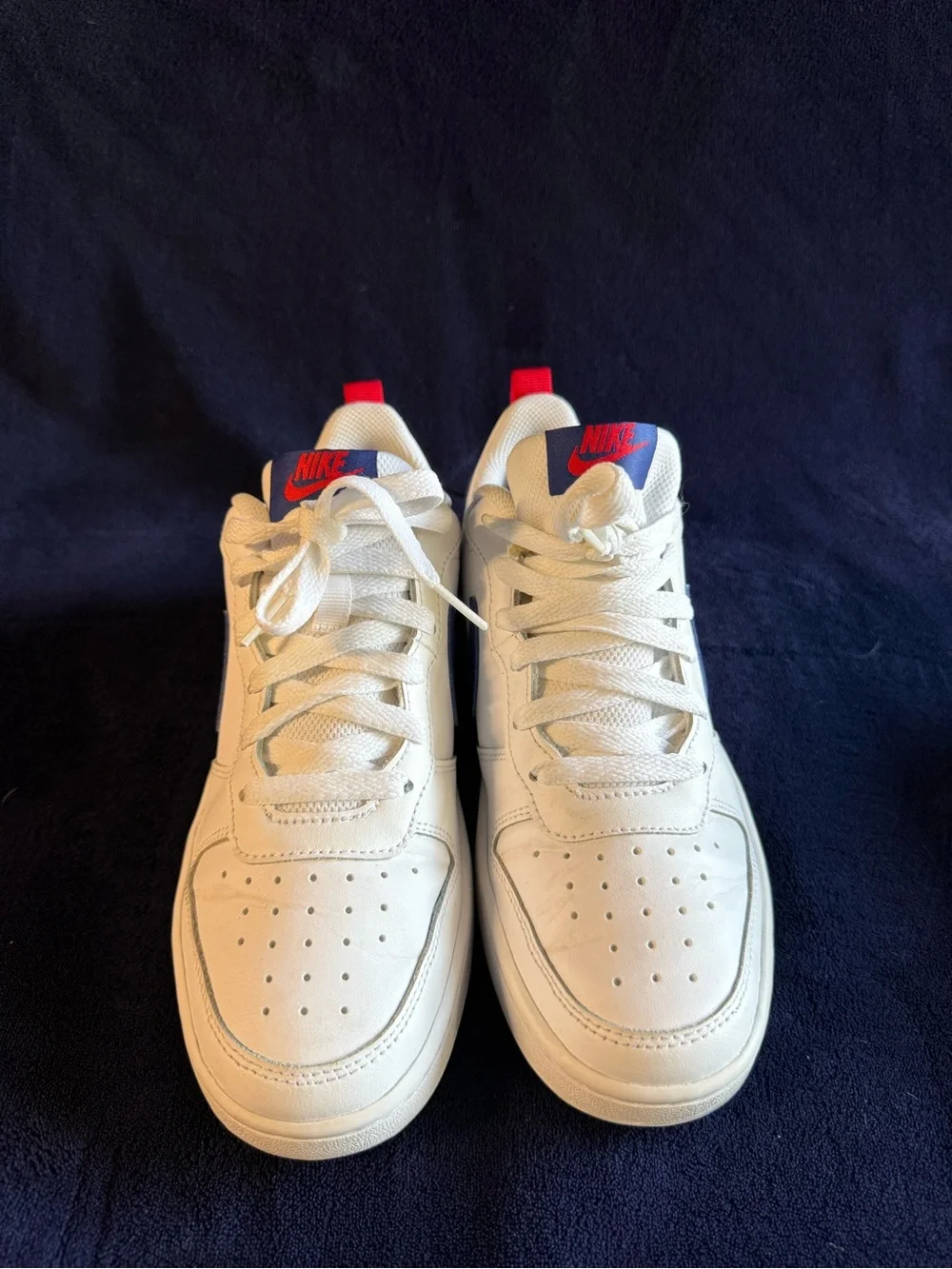 Nike Kids White Sneakers with Blue Swoosh and Red Heel Tab